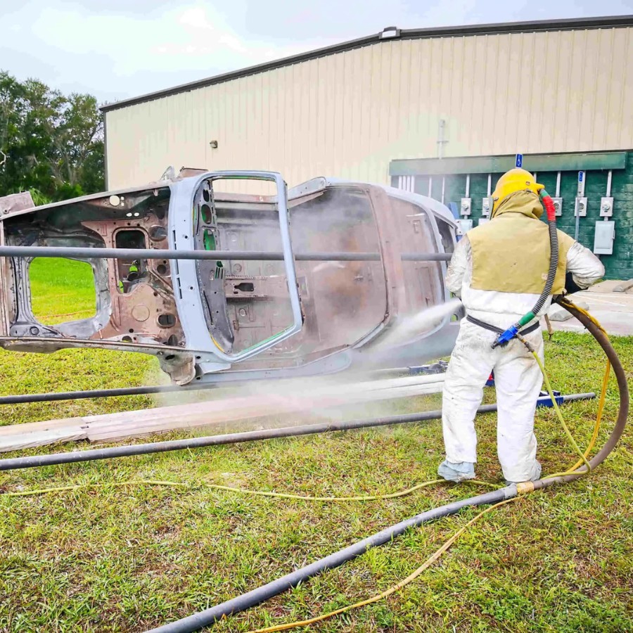 Sandblasting service removing paint from decorative stone surface